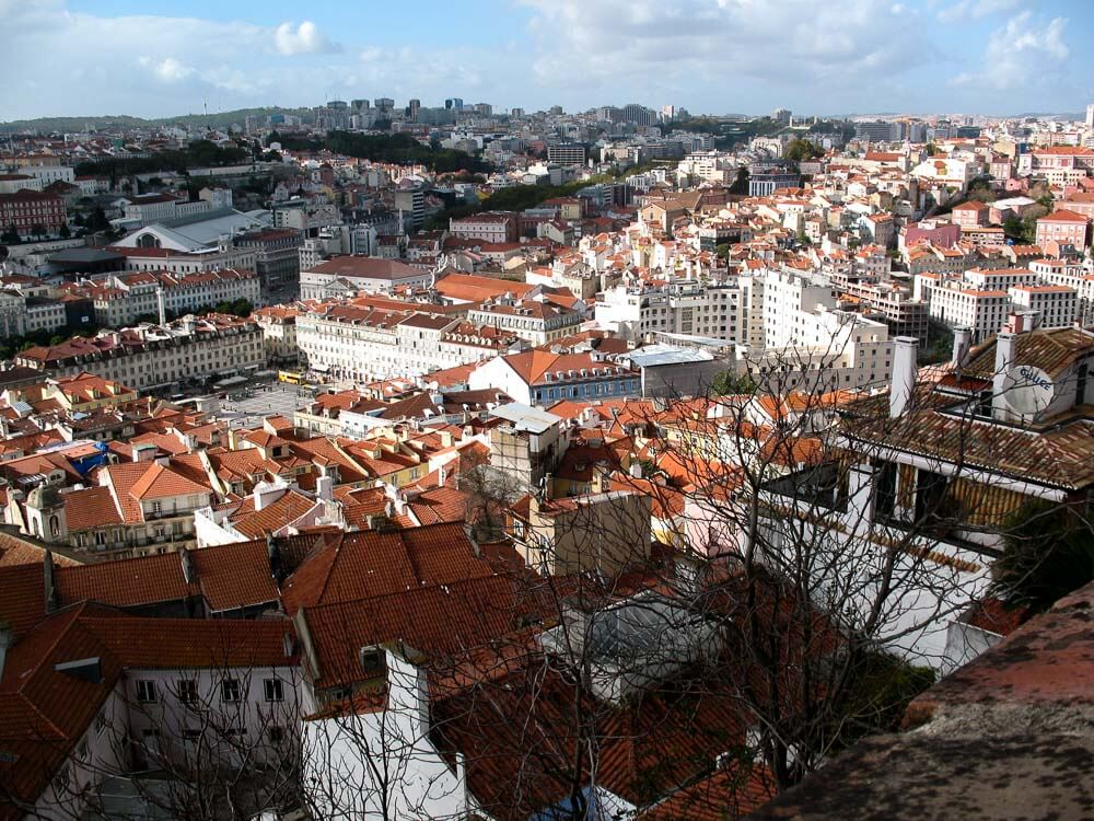 Panoramic view of Lisbon cityscape from a hilltop.