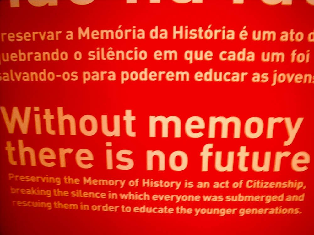 White letters on a red background, saying "Without memory there is no future." The image is slightly blurry.