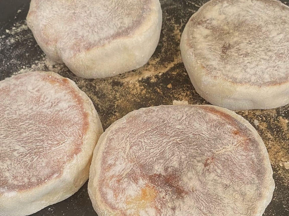 Four Bolos Lêvedos being made.