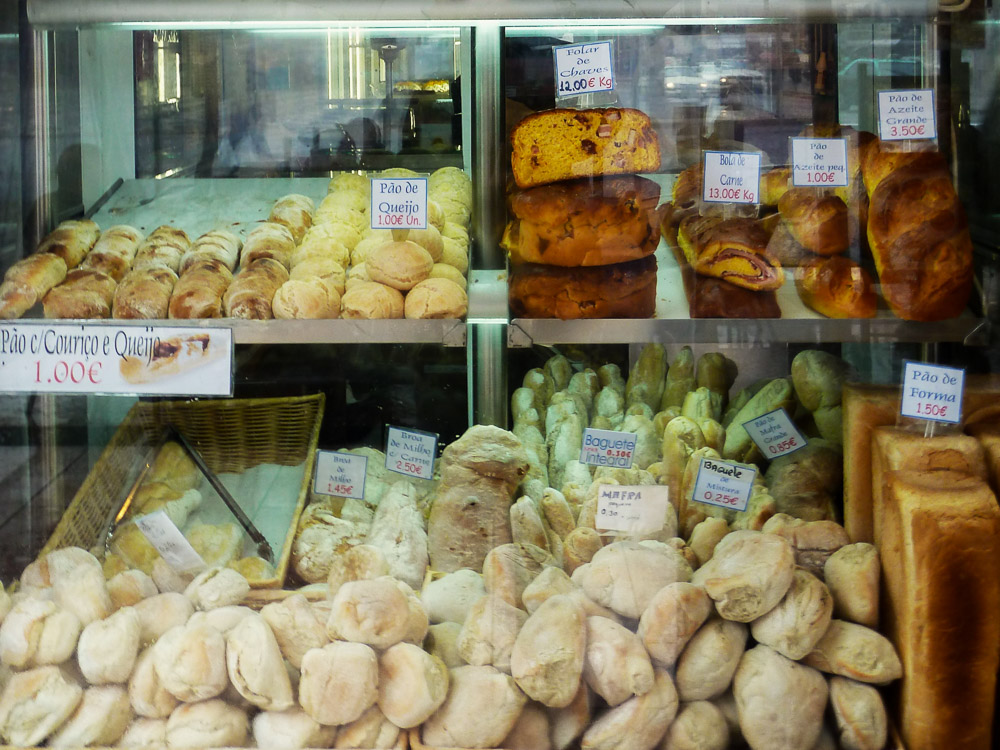 A bakery display in Portugal, filled with different types of bread.