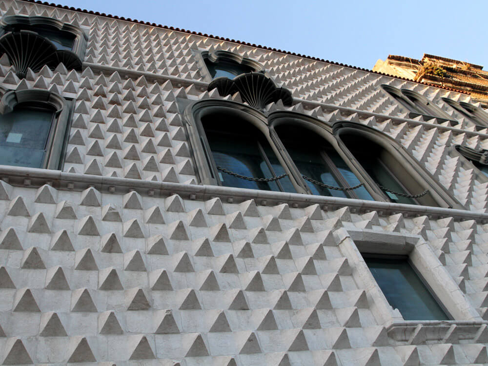 Close-up showcasing the detailed geometric stonework and windows.